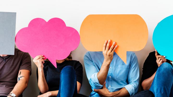 Group of diverse people with speech bubbles icons