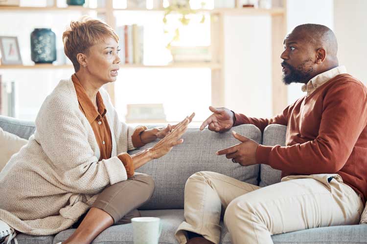couple arguing on couch