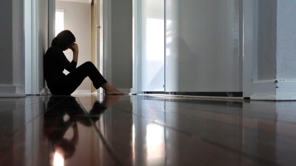 woman grieving on floor