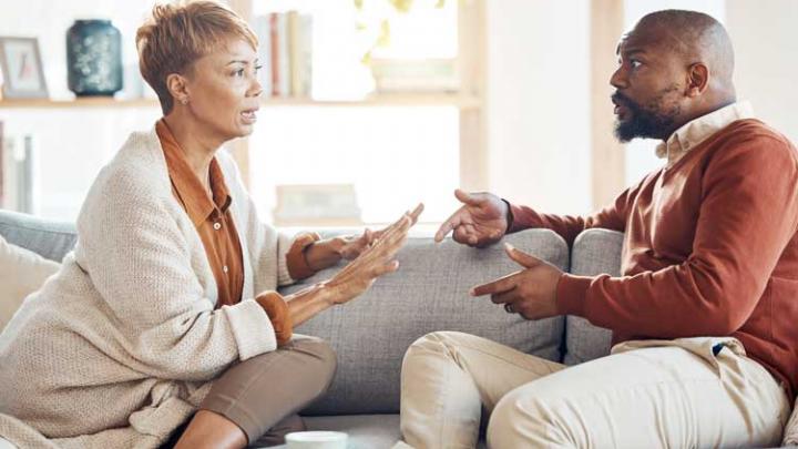 couple arguing on couch