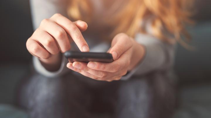 girl looking at phone