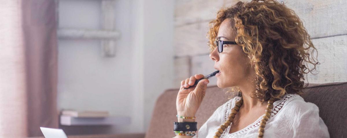 woman thinking writing typing working